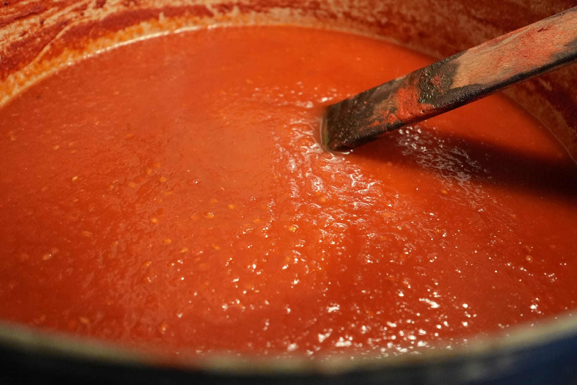 Dutch oven filled with tomato sauce